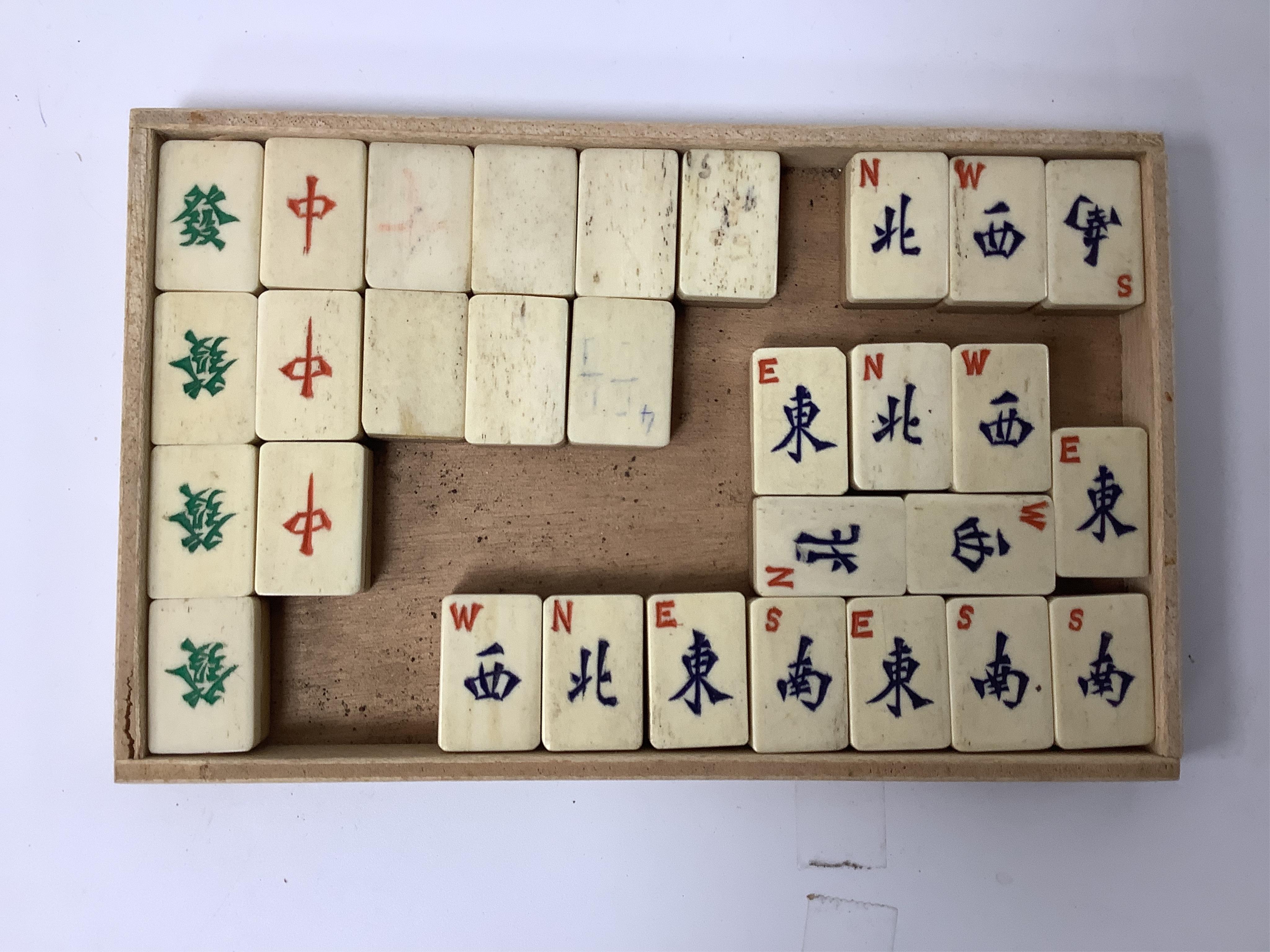 A Chinese bone mahjong set, cased, 23cm wide. Condition - fair